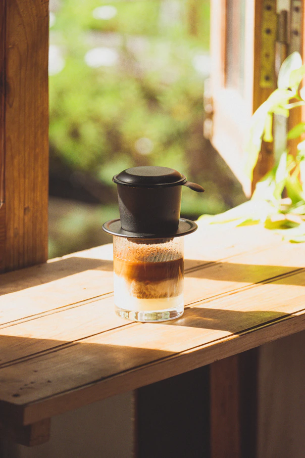 a coffee cup sitting on top of a wooden table