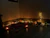 A warm-lit pooja mandir nestled in a cozy modern living room corner.
