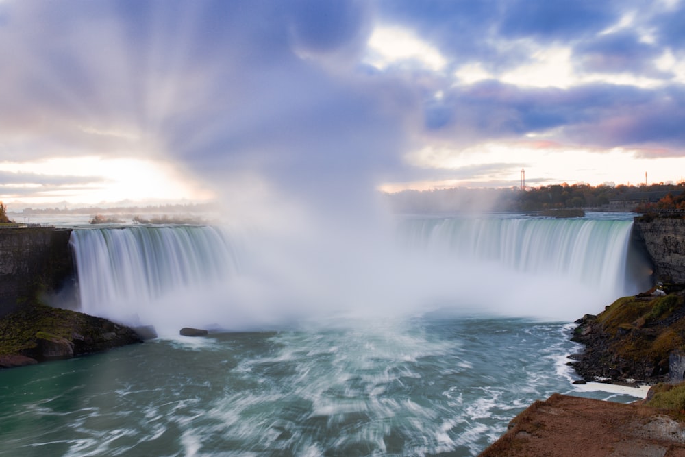 a large waterfall with water pouring out of it