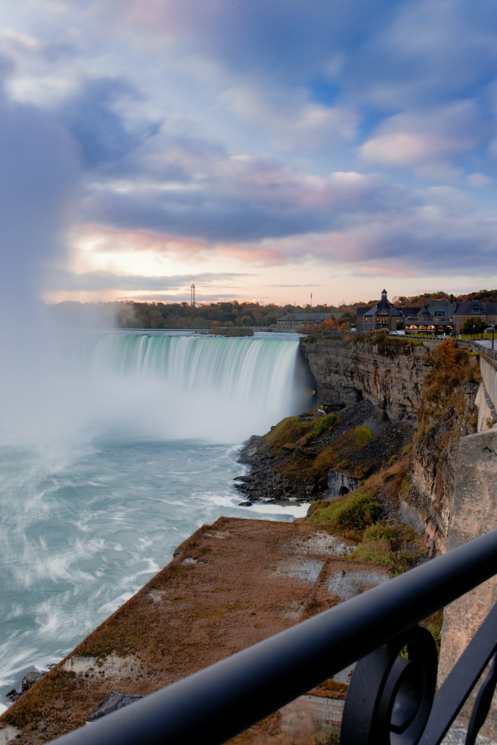 a view of a waterfall from a bridge