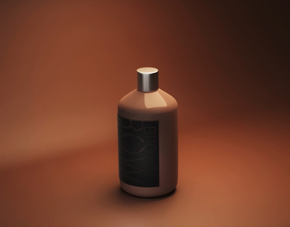 a bottle of lotion on a brown background