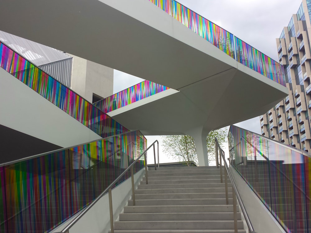 a set of stairs leading up to a multicolored building