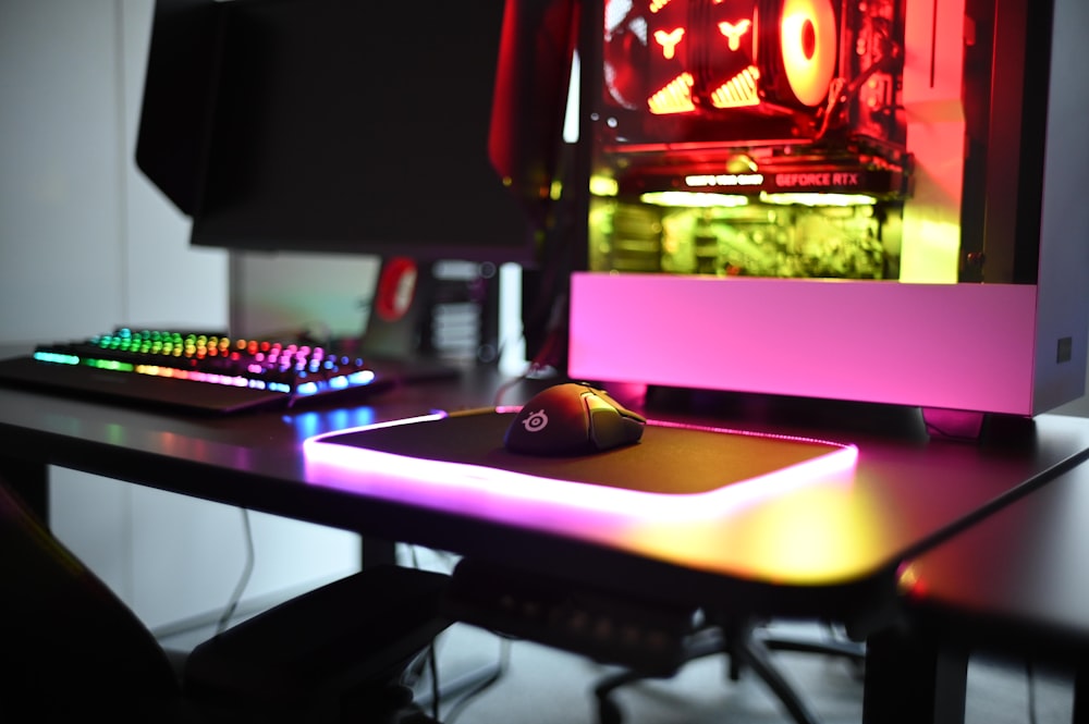 a computer desk with a mouse and keyboard