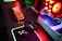 A sleek gaming setup featuring high-end hardware and vibrant LED lighting.
