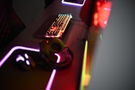 a close up of a keyboard and a mouse on a desk