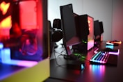 a desk with a keyboard, mouse and speakers