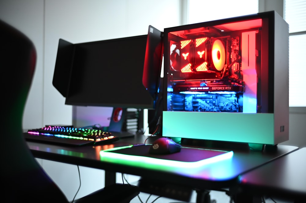 a desk with a computer and a keyboard on it