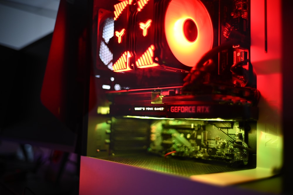 a close up of a computer case with a red light