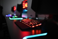 a gaming computer keyboard sitting on top of a desk