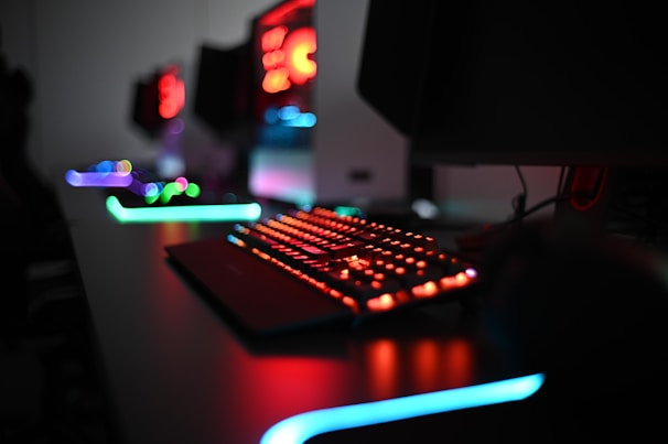 a gaming computer keyboard sitting on top of a desk