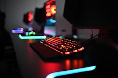 a computer keyboard sitting on top of a desk