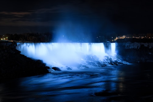 Waterfall feature glowing under soft underwater lighting.