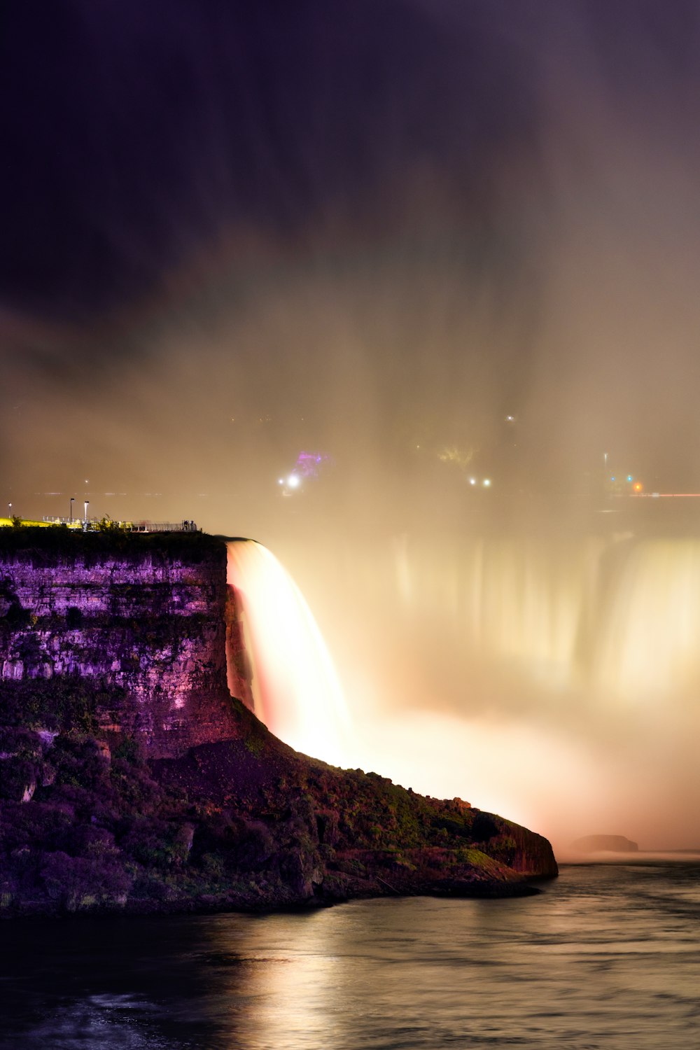 niagara falls at night with the lights on