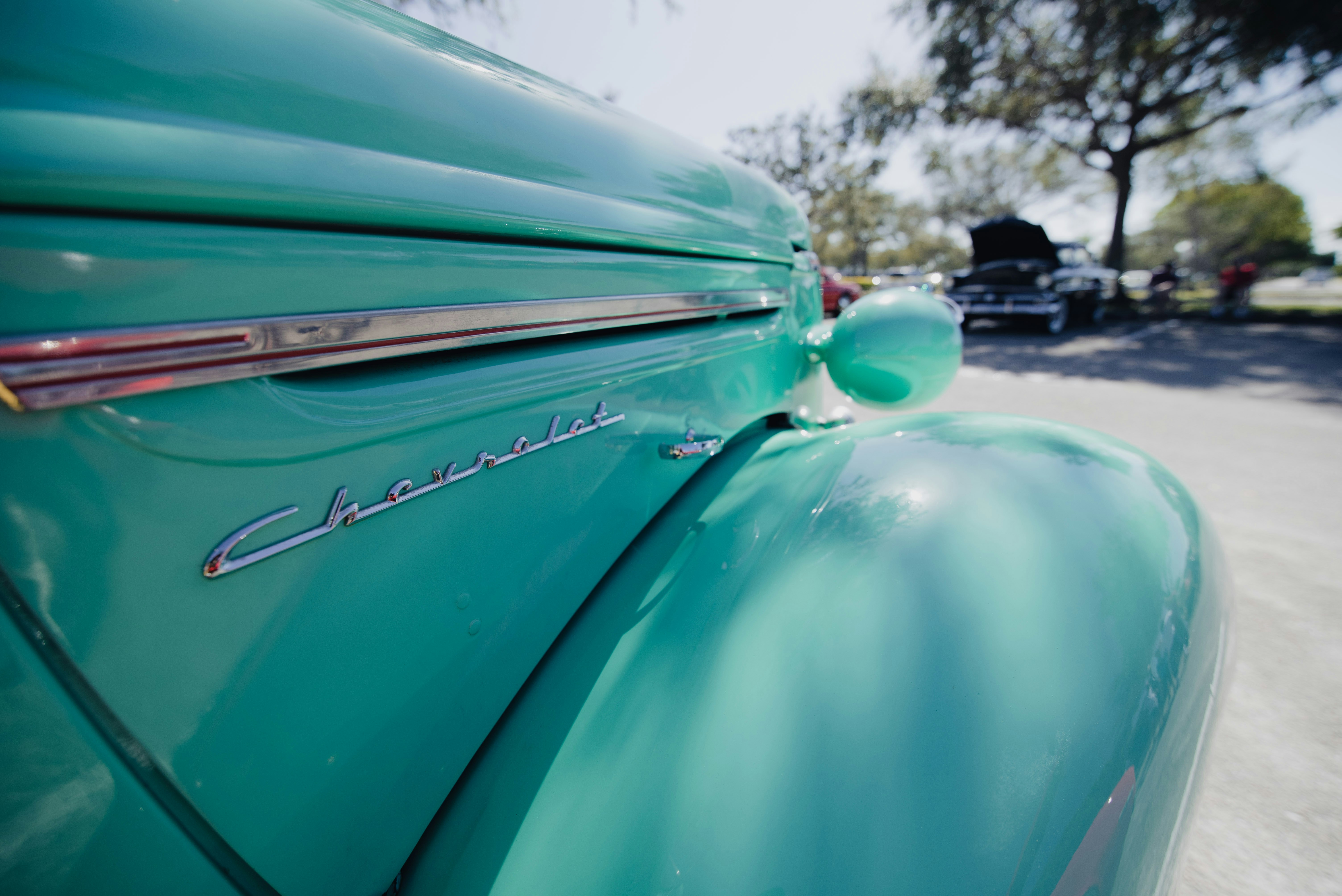 a close up of the hood of a classic car