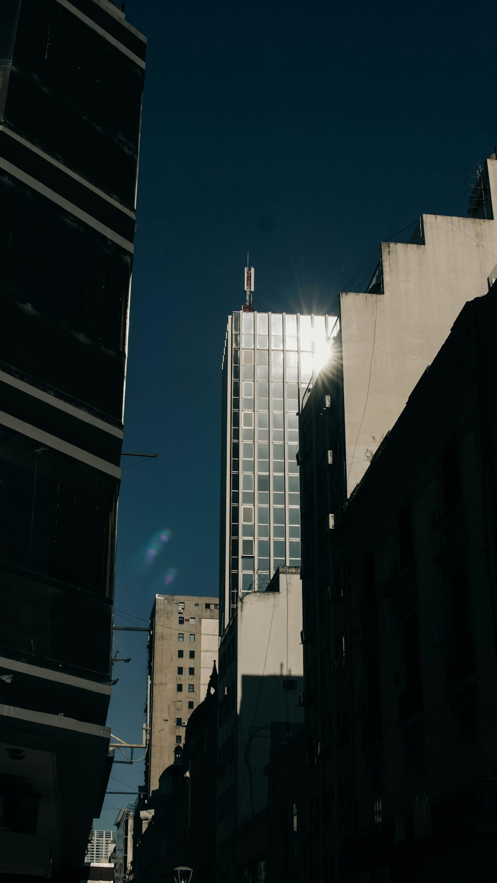 the sun shines through the windows of a tall building