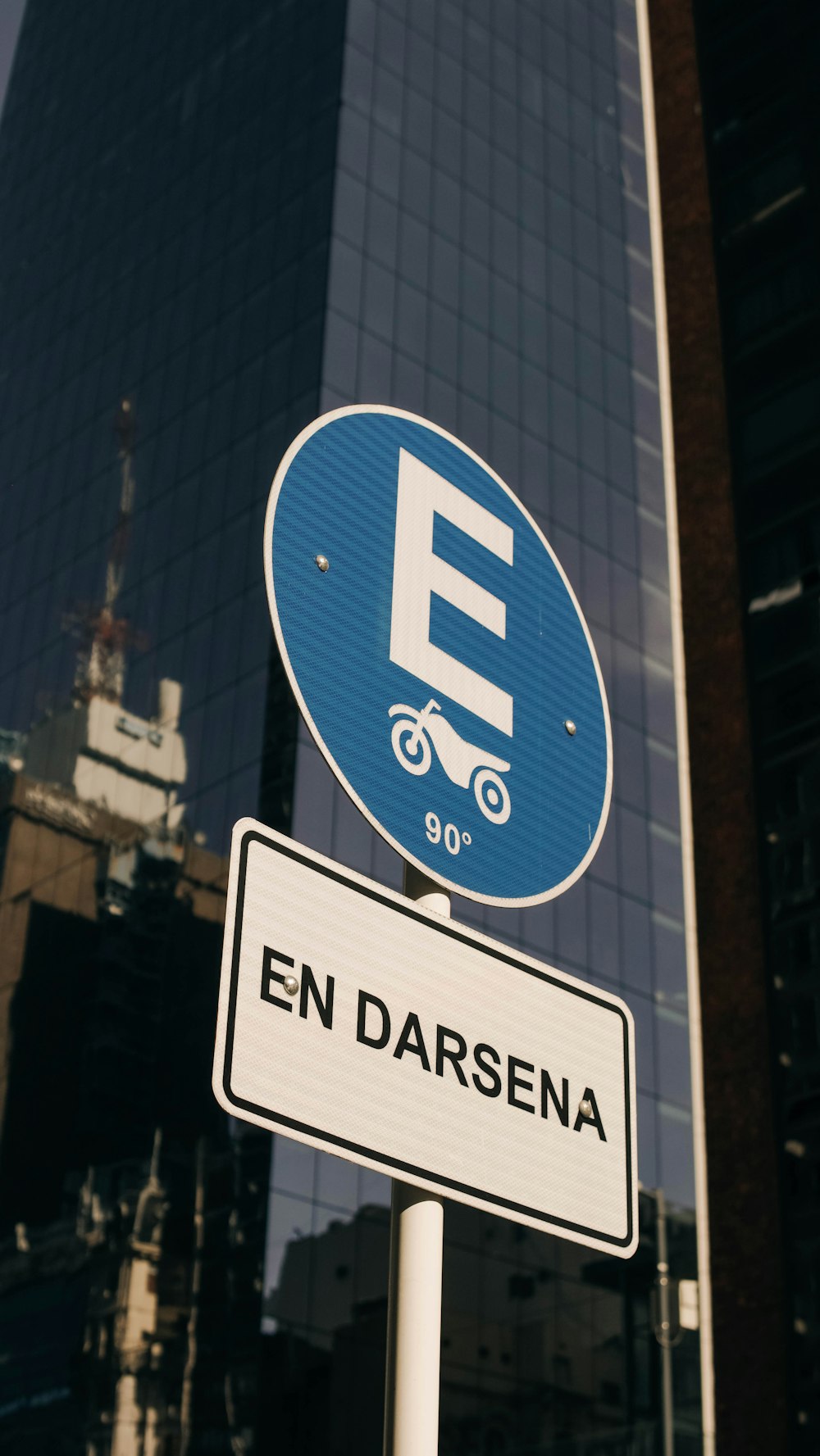 a street sign with a building in the background