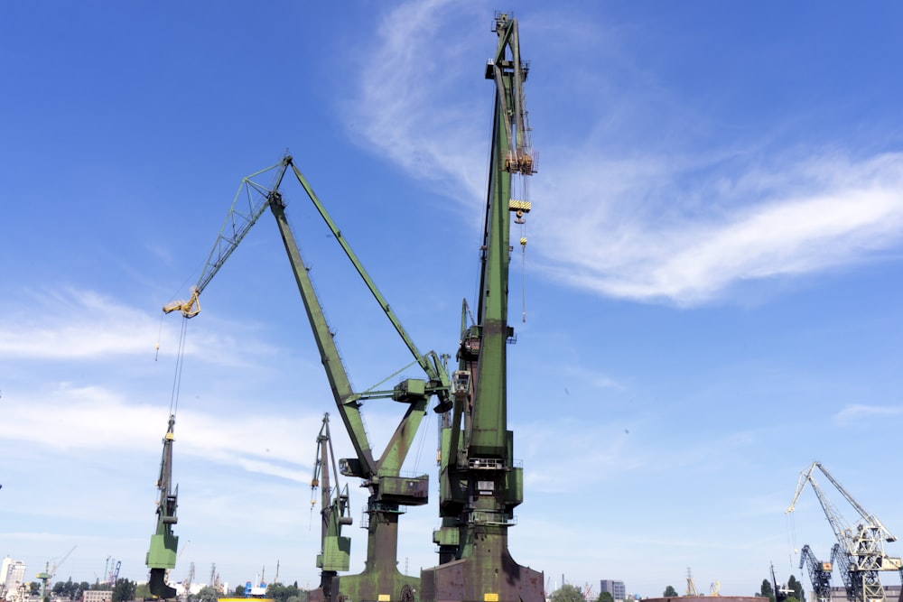 a group of cranes sitting next to each other
