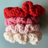 a group of crocheted hearts sitting on top of each other