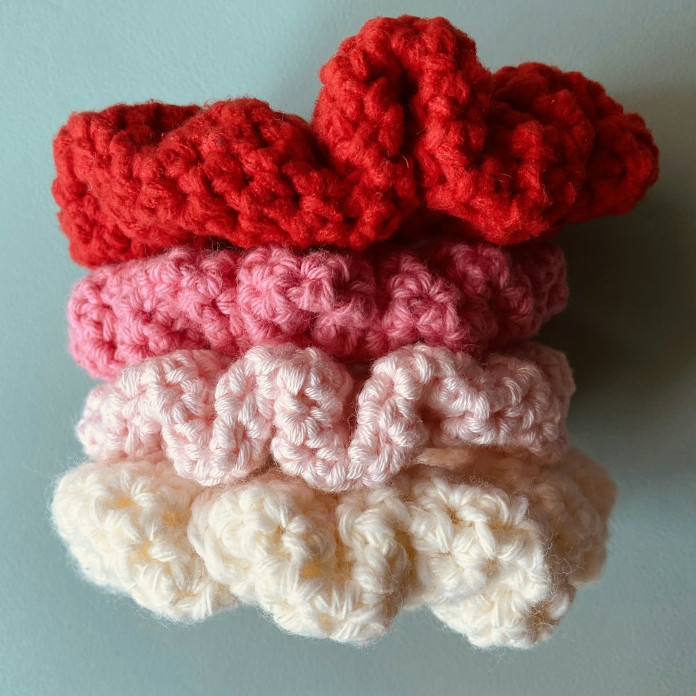 a group of crocheted hearts sitting on top of each other