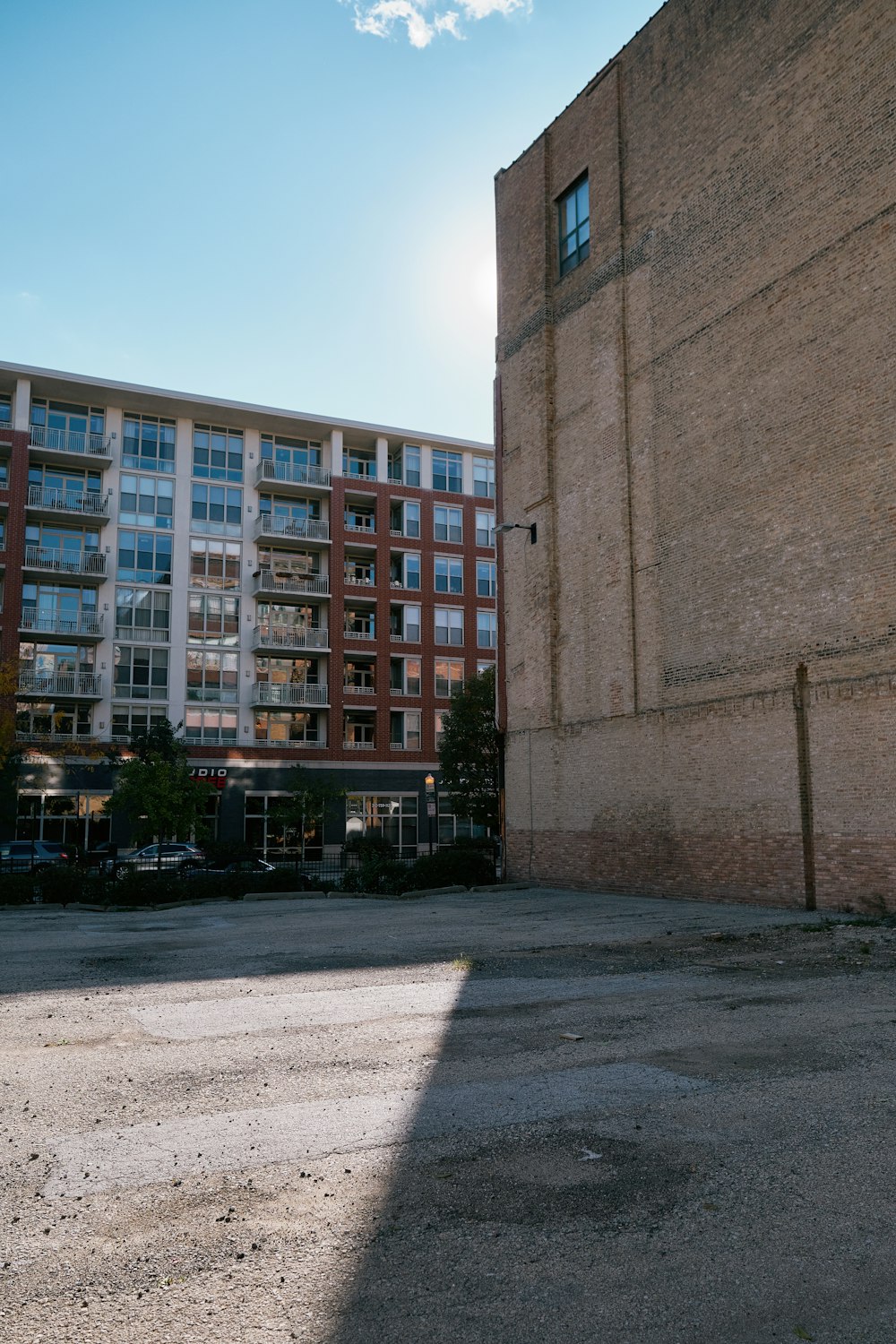 an empty parking lot in front of a building