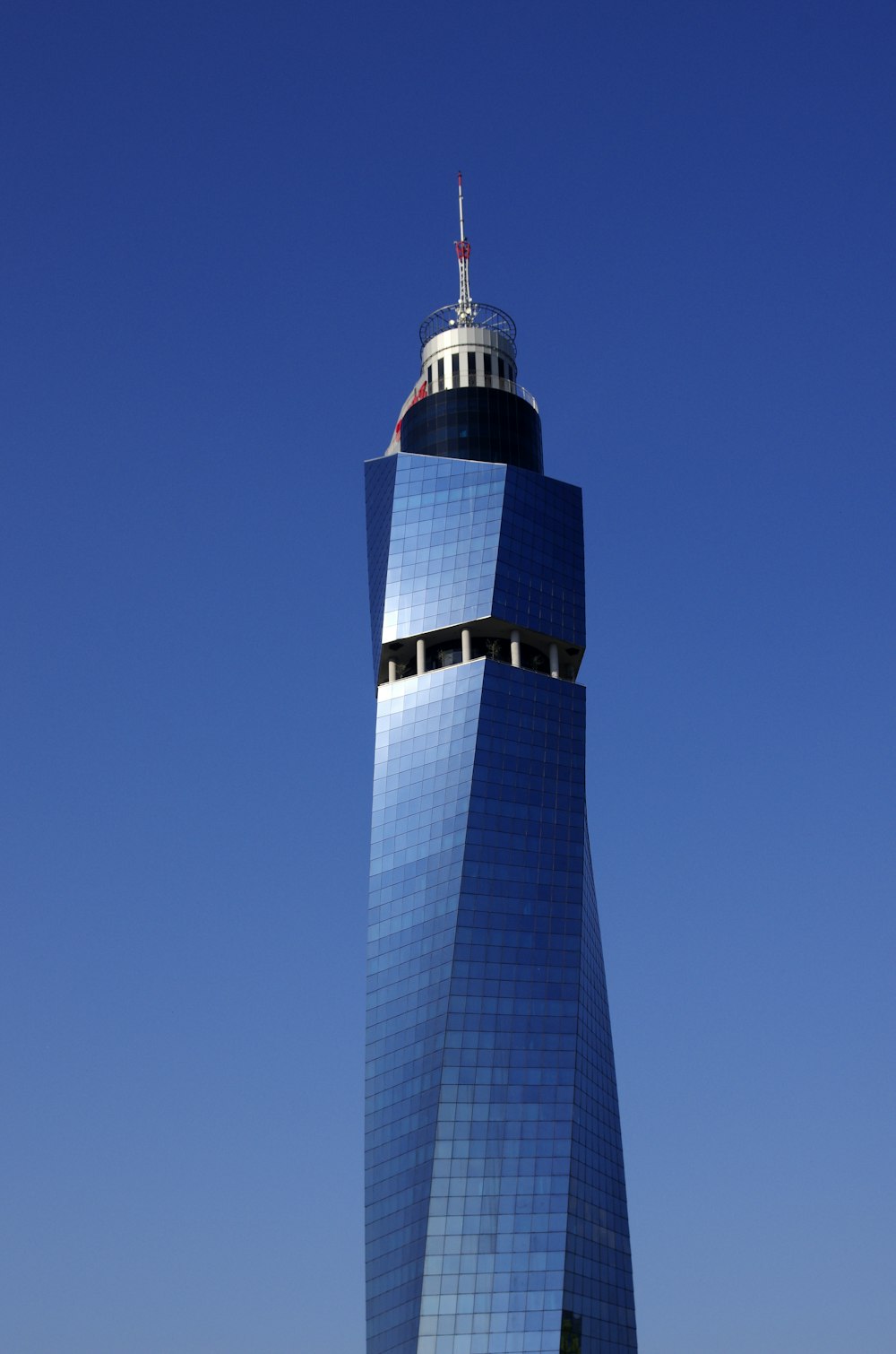 a very tall building with a sky background