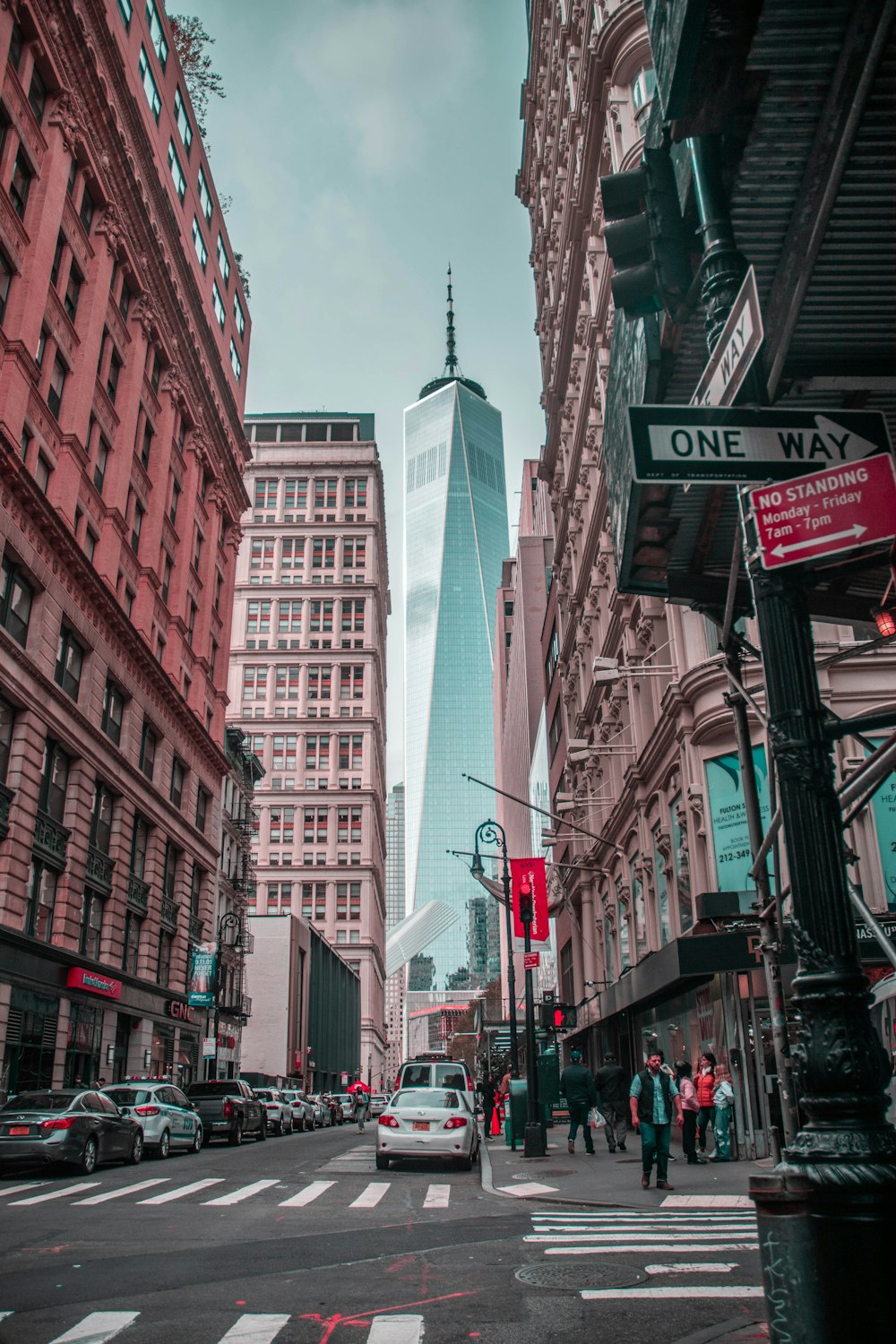 a city street filled with traffic and tall buildings