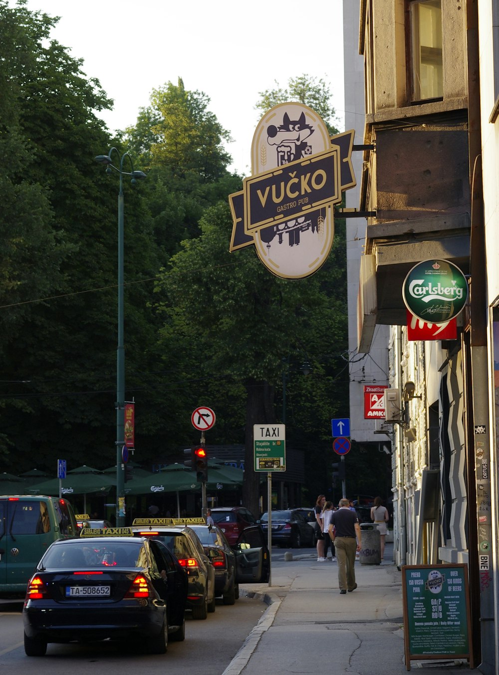 a street with cars parked on the side of it