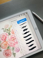 a tablet with a drawing of flowers on it