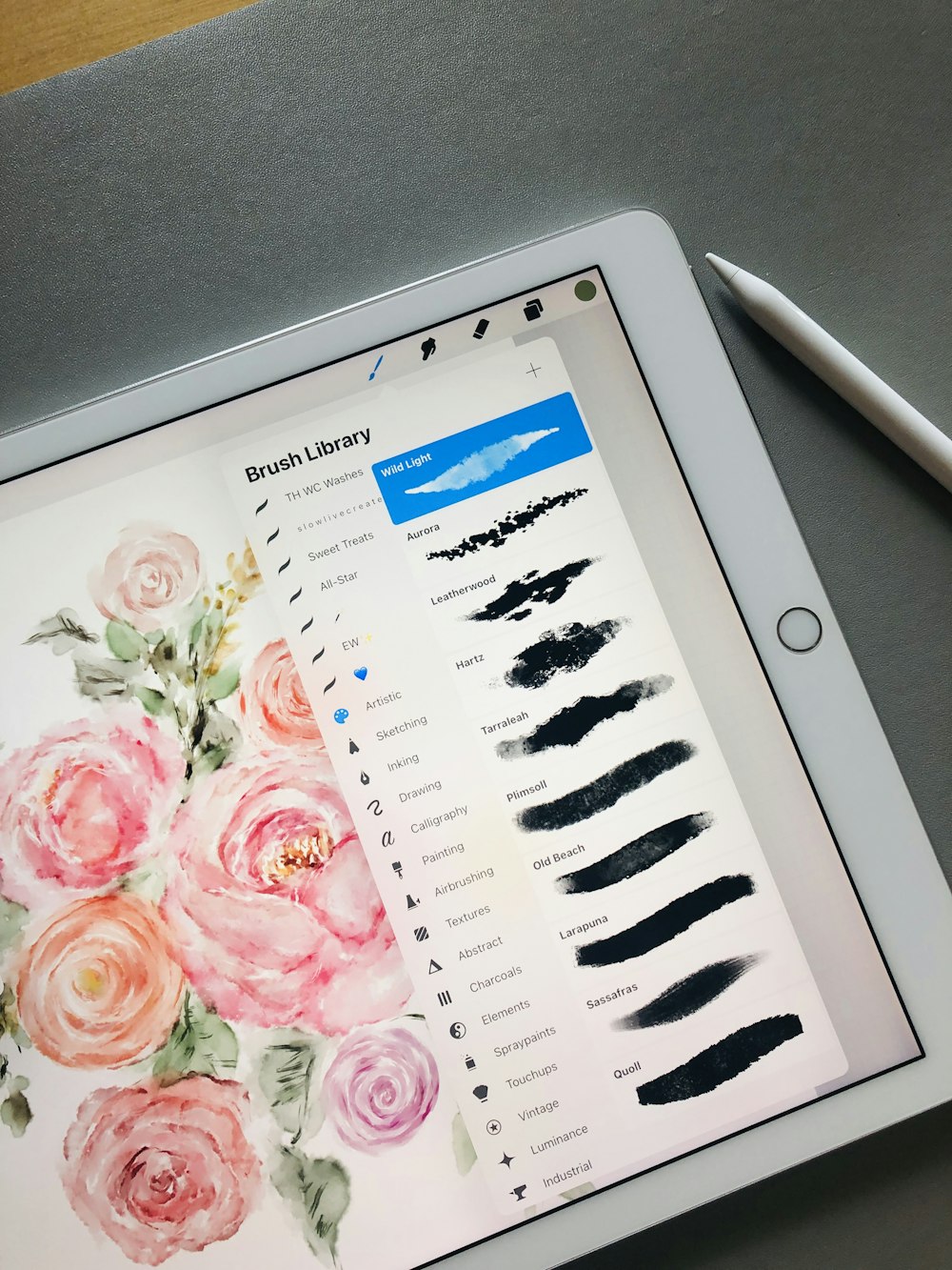 a tablet with a drawing of flowers on it