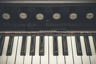 Close-up of vintage keyboard instruments including a Rhodes piano and Hammond organ