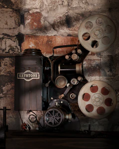 a film projector sitting on top of a wooden table