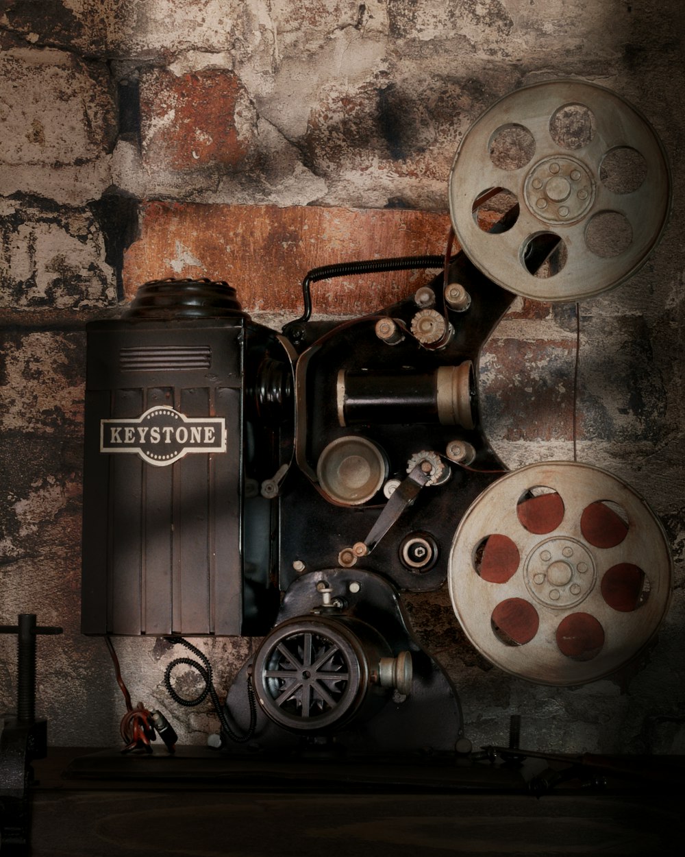 a film projector sitting on top of a wooden table