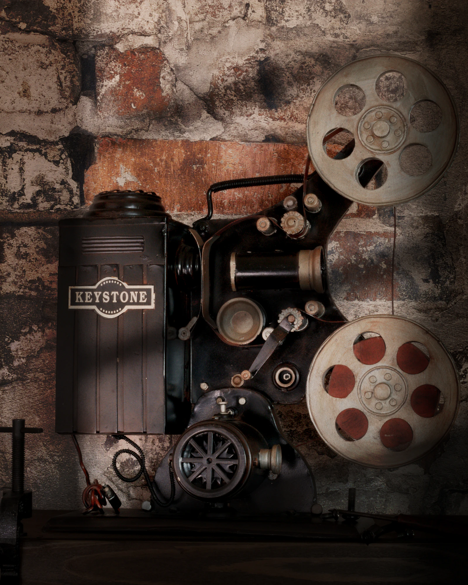 A vintage film projector on a wooden table