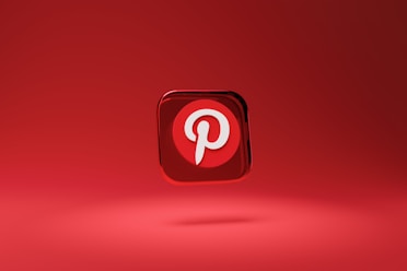 a red square button with a pin on it