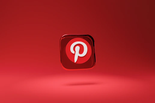 A three-dimensional red icon with a white letter 'P' at its center, floating above a red background. The icon represents the Pinterest logo, which is highlighted by a shadow beneath it, giving it a hovering appearance.