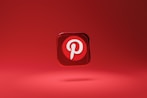 pinterest - a red square button with a pin on it