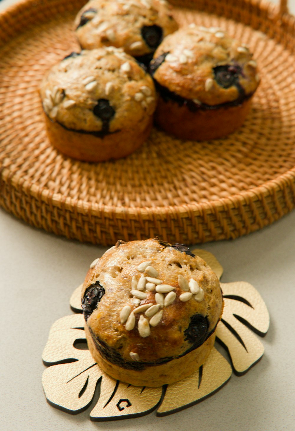 a plate of blueberry muffins on a table