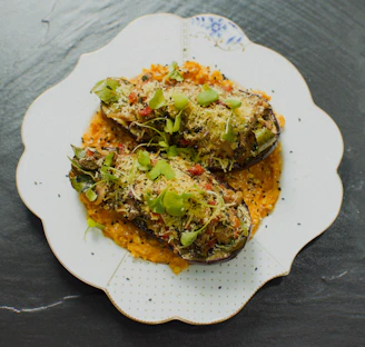 a white plate topped with food on top of a table