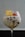 a dessert in a wine glass with fruit on top