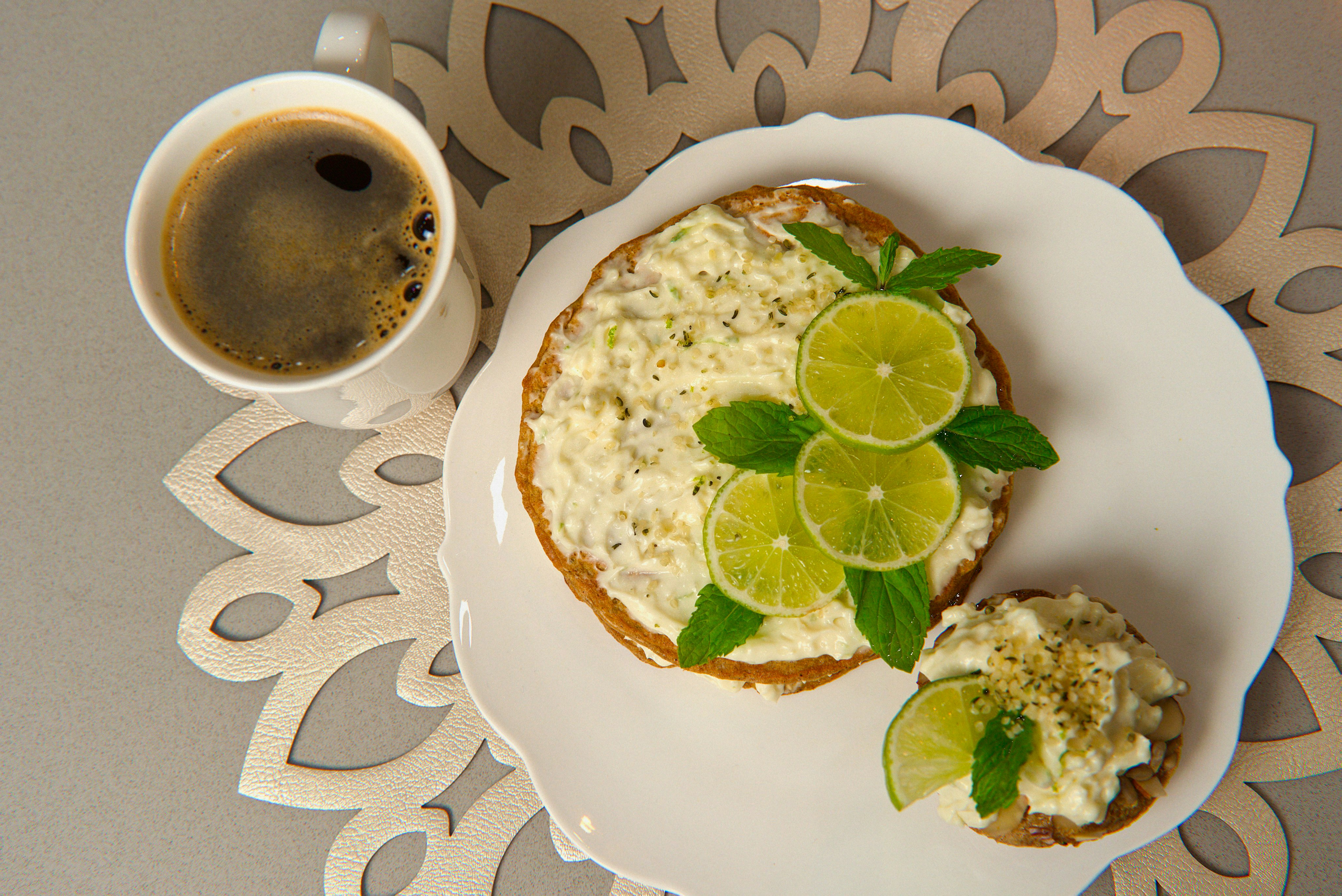 Plate of toast with lime and coffee