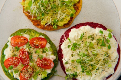 A colorful display of vegetarian sandwich options with vibrant spreads.