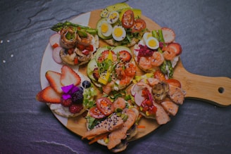 a plate of food that includes shrimp, eggs, and vegetables