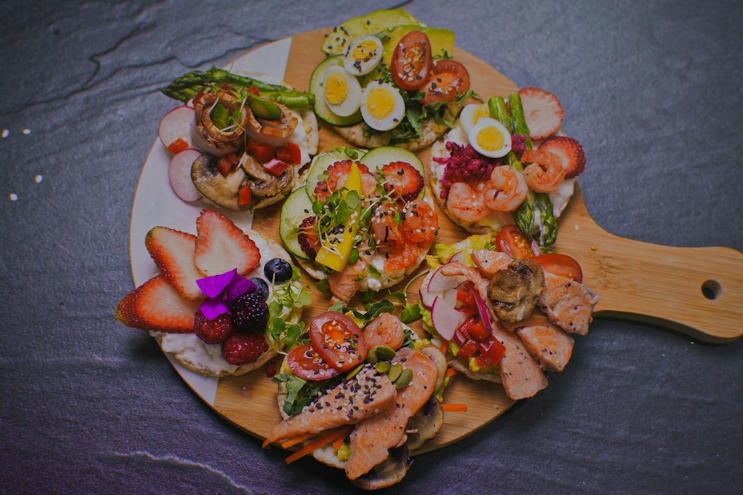 a plate of food that includes shrimp, eggs, and vegetables