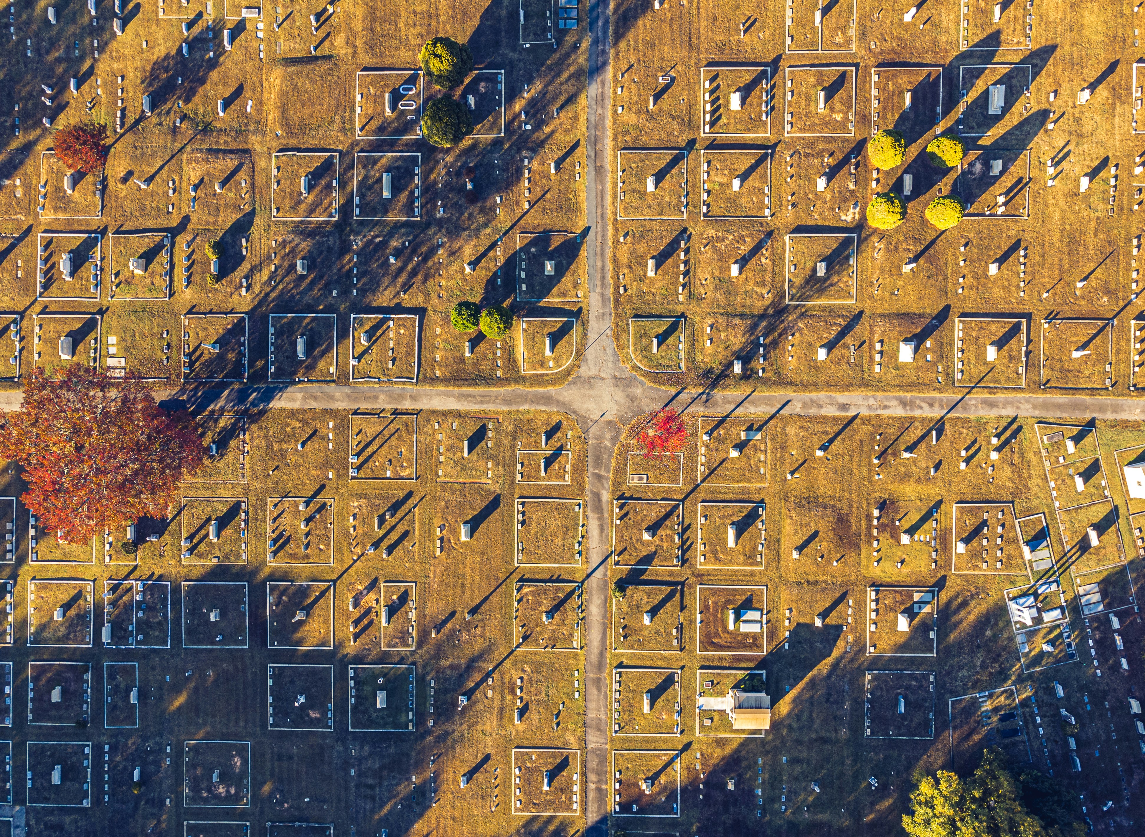 A late fall cemetery aerial view with crossroads.