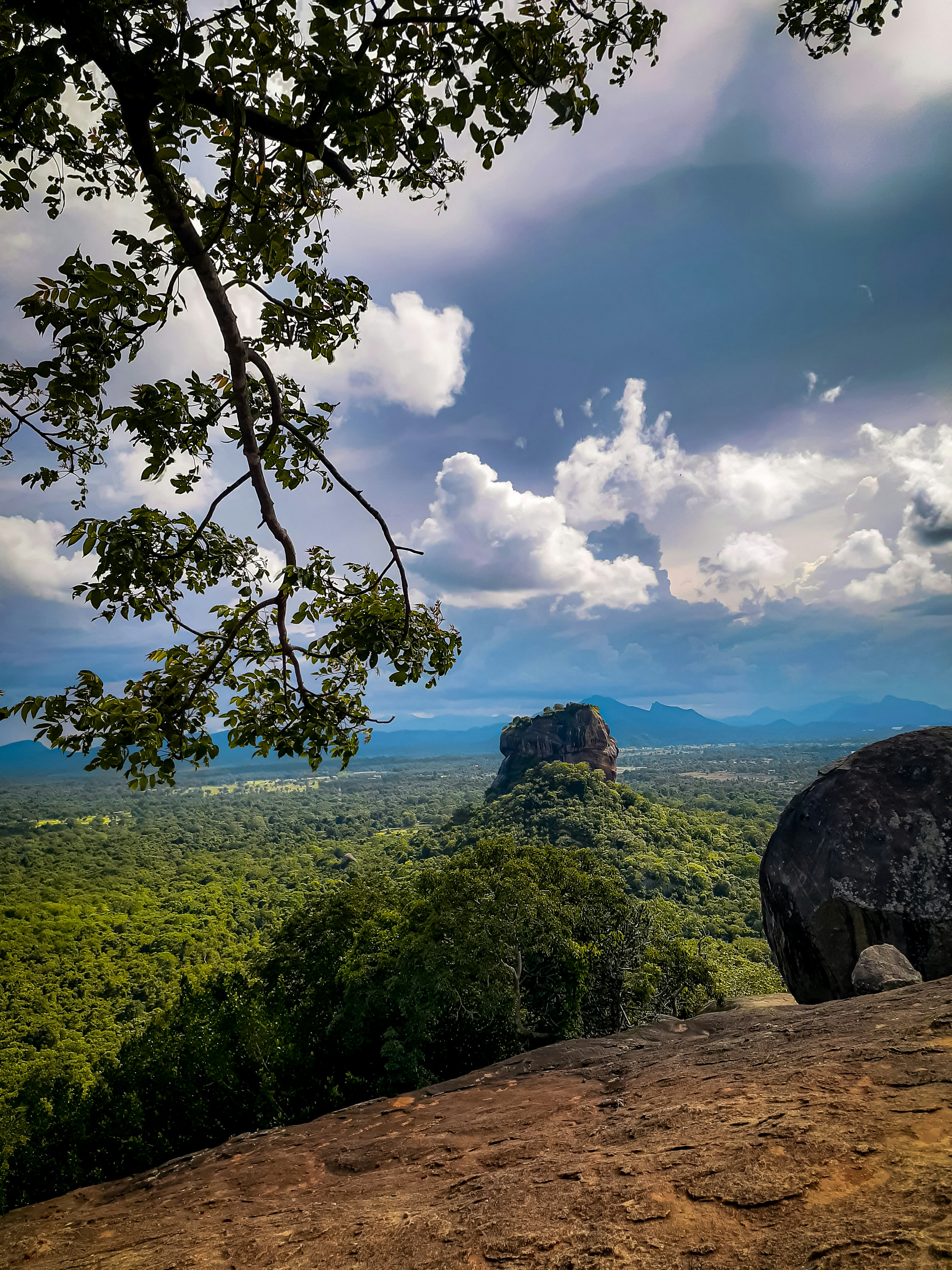 Sigiriya Rock Fortress Matale Sri Lanka, ancient palace ruins atop massive rock, surrounded by jungle