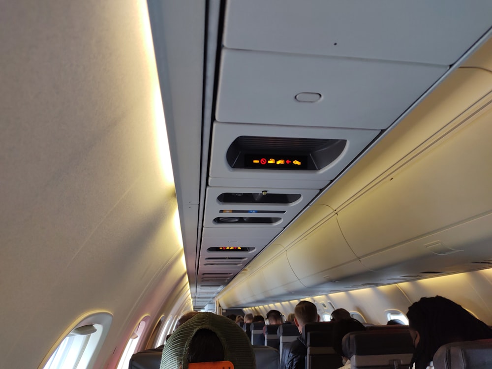 a group of people sitting on an airplane