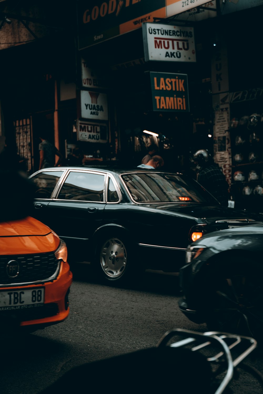 a couple of cars that are sitting in the street