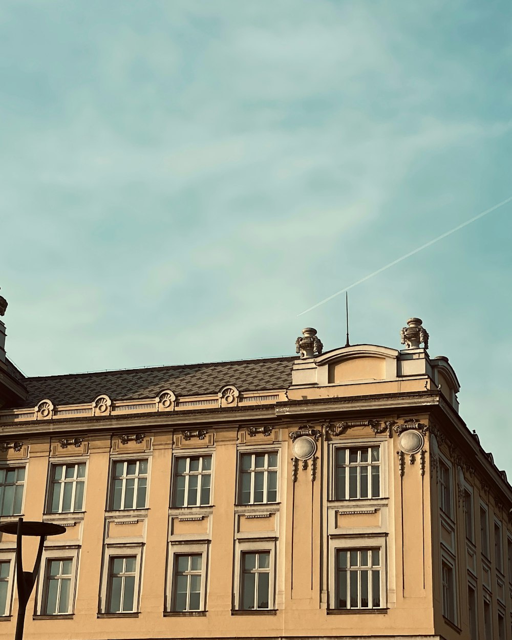 a tall building with a clock on the top of it