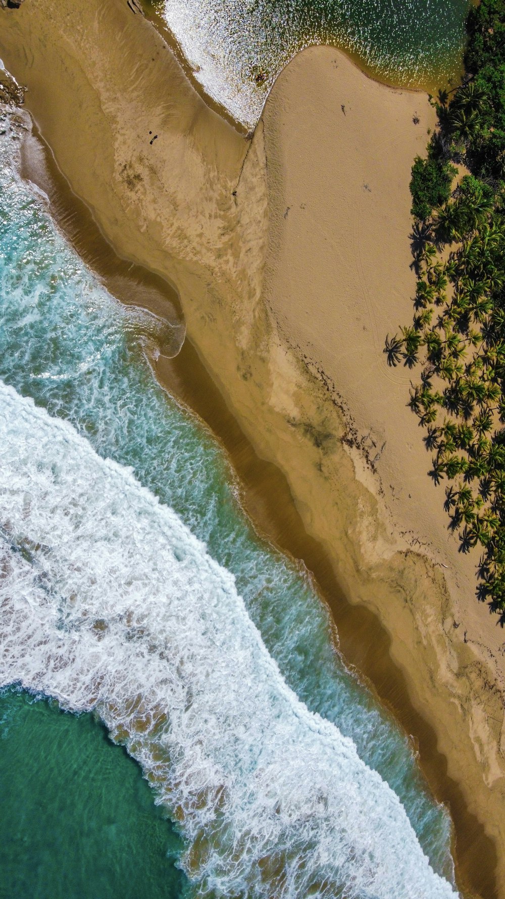 a bird's eye view of a beach and ocean