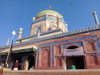 a blue and red building with a dome on top